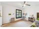 Bedroom with workstation, ceiling fan, and good natural light at 5702 Ainsworth W Ct, Tampa, FL 33647