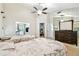 Bright bedroom with two beds, ample closet space, and large mirrored dresser at 5702 Ainsworth W Ct, Tampa, FL 33647