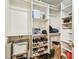 Organized closet with ample shelf and hanging storage, providing convenient organization at 5702 Ainsworth W Ct, Tampa, FL 33647