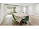 Dining room with a table seating four and sliding door access to the outdoors at 5702 Ainsworth W Ct, Tampa, FL 33647