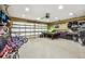 Garage containing multiple bikes, pool table, and storage at 5702 Ainsworth W Ct, Tampa, FL 33647