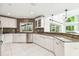 Well-appointed kitchen features granite countertops, stainless appliances, and tiled backsplash at 5702 Ainsworth W Ct, Tampa, FL 33647