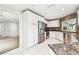 Spacious kitchen with marble floors, stainless steel appliances and opening to living spaces at 5702 Ainsworth W Ct, Tampa, FL 33647