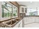 Gourmet kitchen features granite countertops, stainless appliances, and tiled backsplash at 5702 Ainsworth W Ct, Tampa, FL 33647