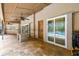 Covered lanai features travertine tile, outdoor bar and a view of the screened-in pool at 5702 Ainsworth W Ct, Tampa, FL 33647
