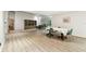 Large living area with dining area, modern flooring, and access to outdoor living, providing ample room for entertaining at 5702 Ainsworth W Ct, Tampa, FL 33647