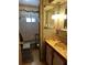 Bathroom with a green floral decor, bathtub and mirror at 6099 107Th N Ave, Pinellas Park, FL 33782