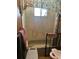 Cozy bathroom includes a bathtub with shower curtain and floral wallpaper, a functional space at 6099 107Th N Ave, Pinellas Park, FL 33782