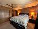 Comfortable bedroom featuring a queen bed, ceiling fan, and built-in storage at 6099 107Th N Ave, Pinellas Park, FL 33782