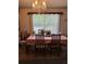Bright dining room with chandelier, table, chairs and a large window at 6099 107Th N Ave, Pinellas Park, FL 33782