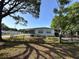 Charming single-story home with a well-maintained yard and a covered carport, blending comfort and convenience at 6099 107Th N Ave, Pinellas Park, FL 33782