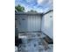 Exterior view of a shed, featuring closed doors, with room for outdoor activities at 6099 107Th N Ave, Pinellas Park, FL 33782