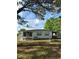 Charming single-story home with a well-maintained lawn and beautiful, mature landscaping at 6099 107Th N Ave, Pinellas Park, FL 33782