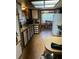 Traditional kitchen with wooden cabinets and countertops, leading into dining area at 6099 107Th N Ave, Pinellas Park, FL 33782