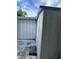 Shows the exterior of the shed with a simple design and neutral colors at 6099 107Th N Ave, Pinellas Park, FL 33782