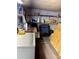 Functional storage shed interior with shelves and a washer, ideal for organization and utility at 6099 107Th N Ave, Pinellas Park, FL 33782