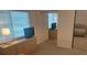 Comfortable bedroom with plush carpet, mirrored closet doors, and a view of the room from a mirrored wall at 650 Pinellas Point S Dr # 101, St Petersburg, FL 33705