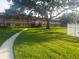 Beautiful community grounds featuring mature trees and lush landscaping that creates a park-like setting for residents at 650 Pinellas Point S Dr # 101, St Petersburg, FL 33705