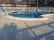 Enjoy a refreshing dip in this outdoor pool area with ample lounge chairs and a white picket fence at 650 Pinellas Point S Dr # 101, St Petersburg, FL 33705