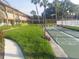 Active community featuring shuffleboard courts surrounded by lush landscaping and walkways at 650 Pinellas Point S Dr # 101, St Petersburg, FL 33705