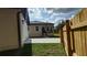 View of backyard, back of the main house and the garage, and the concrete at 7013 N 15Th St, Tampa, FL 33610