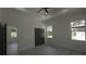 Bedroom featuring light floors, recessed lighting, ceiling fan, and view of the yard through the windows at 7013 N 15Th St, Tampa, FL 33610
