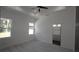Bedroom featuring light wood floors, recessed lighting, and an ensuite bathroom at 7013 N 15Th St, Tampa, FL 33610