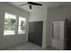 Bedroom features multiple windows for natural light and closet at 7013 N 15Th St, Tampa, FL 33610