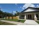 Well-maintained home with a tidy lawn, fresh plantings, and a newly stained fence at 7013 N 15Th St, Tampa, FL 33610