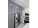 Grey cabinets and stainless steel fridge in this modern kitchen at 7013 N 15Th St, Tampa, FL 33610