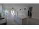 Spacious living room featuring an island, modern light fixtures, and a sliding glass door at 7013 N 15Th St, Tampa, FL 33610