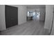 Open-concept living space with modern flooring, recessed lighting, and seamless flow to the kitchen at 7013 N 15Th St, Tampa, FL 33610