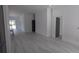 Bright and airy living space featuring neutral walls, stylish flooring, and ample natural light at 7013 N 15Th St, Tampa, FL 33610