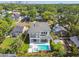 Aerial view of new construction home showcasing pool, spa, balcony and modern design at 715 W Peninsular St, Tampa, FL 33603