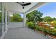 Spacious tiled balcony with black railing, ceiling fan, and lots of natural light at 715 W Peninsular St, Tampa, FL 33603