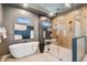 Luxurious bathroom with freestanding tub, glass shower, and modern fixtures for a spa-like experience at 715 W Peninsular St, Tampa, FL 33603
