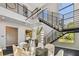 Modern dining room with a glass table, stylish chairs, and a view of the staircase at 715 W Peninsular St, Tampa, FL 33603