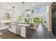 Open concept kitchen with a waterfall island, stainless steel appliances, and contemporary design at 715 W Peninsular St, Tampa, FL 33603