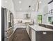 Stylish kitchen featuring stainless steel appliances, a center island, and modern lighting fixtures at 715 W Peninsular St, Tampa, FL 33603