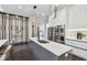 Contemporary kitchen featuring white cabinets, a large island, and stainless steel appliances at 715 W Peninsular St, Tampa, FL 33603