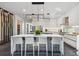 Contemporary kitchen featuring a center island with seating, a wine rack, and modern lighting at 715 W Peninsular St, Tampa, FL 33603