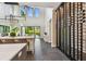 Bright, airy living space with floor-to-ceiling windows, a modern wine rack, and sleek finishes at 715 W Peninsular St, Tampa, FL 33603