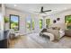 Spacious main bedroom features hardwood floors, neutral decor, and bright natural light at 715 W Peninsular St, Tampa, FL 33603
