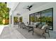 Outdoor living with multiple ceiling fans and seating options by the pool at 715 W Peninsular St, Tampa, FL 33603