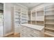 Large walk-in closet with custom storage solutions, including shelving and drawers for optimal organization at 715 W Peninsular St, Tampa, FL 33603