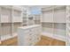 Spacious walk-in closet with custom shelving and drawers, offering ample storage and organization at 715 W Peninsular St, Tampa, FL 33603