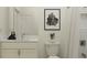 Modern bathroom featuring a white vanity with marble countertop and subway-tiled shower at 7545 E 116Th St, Palmetto, FL 34221