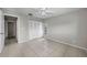 Bedroom with tile floors, neutral paint, and closet at 843 Greenfield Dr, Palm Harbor, FL 34684