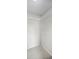 Walk-in closet with shelving and tile floors at 843 Greenfield Dr, Palm Harbor, FL 34684