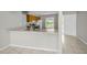 Kitchen featuring stainless steel sink, lots of counter space and tile flooring at 843 Greenfield Dr, Palm Harbor, FL 34684
